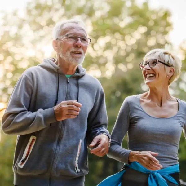 Elderly couple jog together