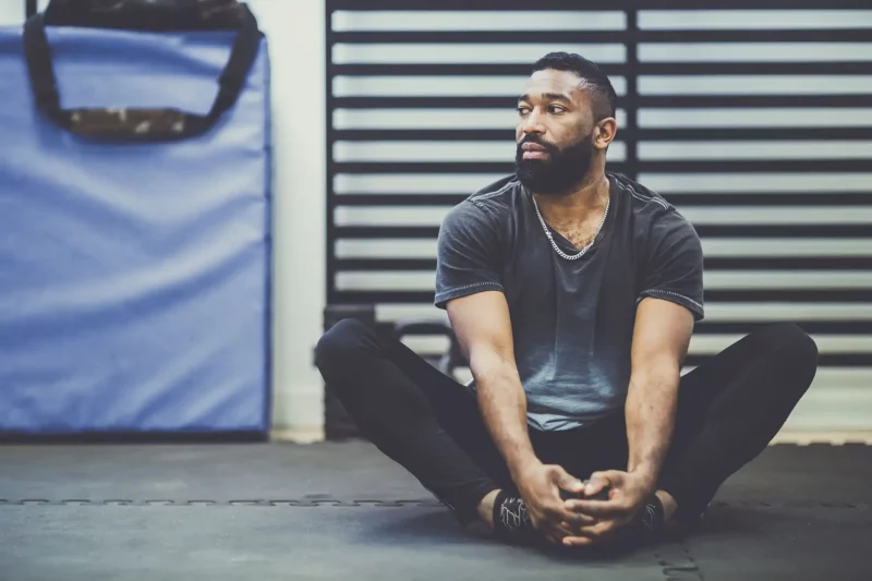 Man stretching in gym